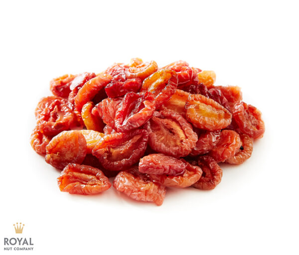 white background with an orange pile of dried Australian plums in the middle