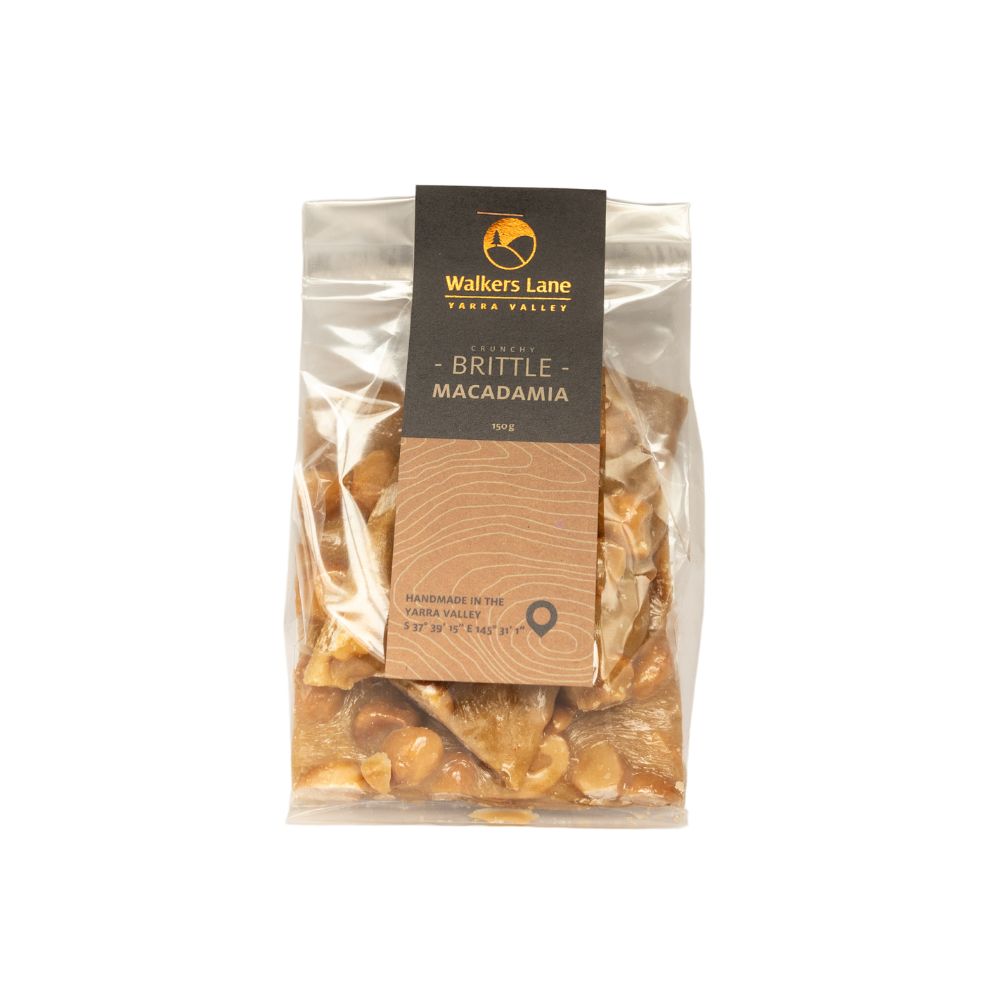 macadamia brittle A white background image with a bag of macadamia brittle