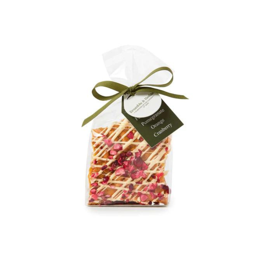 Pomegranate, Cranberry, Orange & White Belgian Chocolate Peanut Brittle white background image with a Pomegranate, Cranberry, Orange & White Belgian Chocolate Peanut Brittle