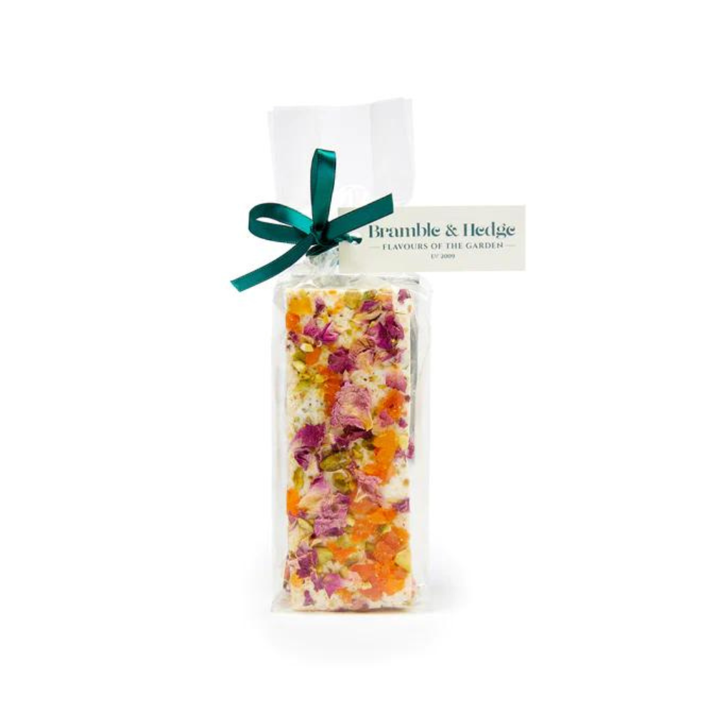 Apricot & Cardamom, Pistachio Nuts, Rose Petals & Belgian White Chocolate Nougat A white background image with a Apricot & Cardamom, Pistachio Nuts, Rose Petals & Belgian White Chocolate Nougat